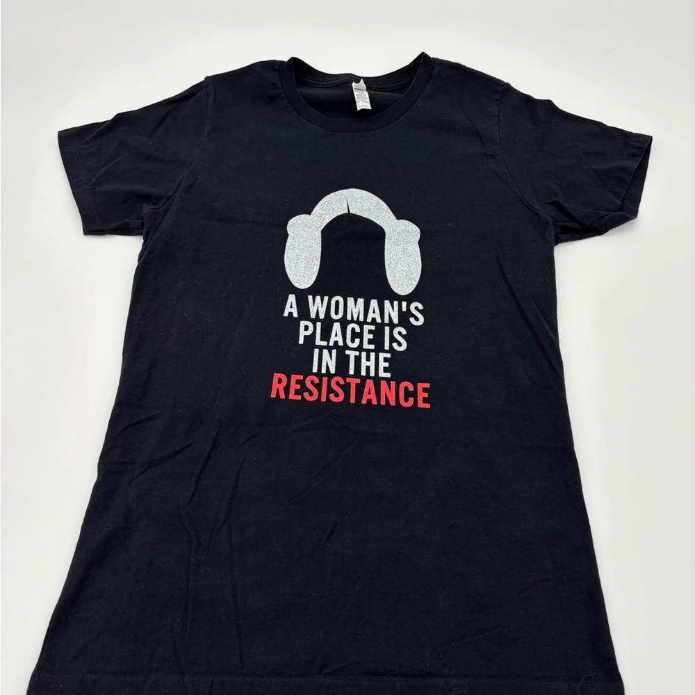 A Woman’s Place Is in the Resistance Graphic T-Shirt – Women’s Large – Black